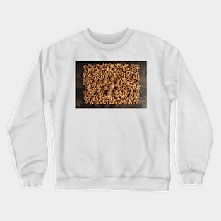 Walnuts on a wooden board Crewneck Sweatshirt